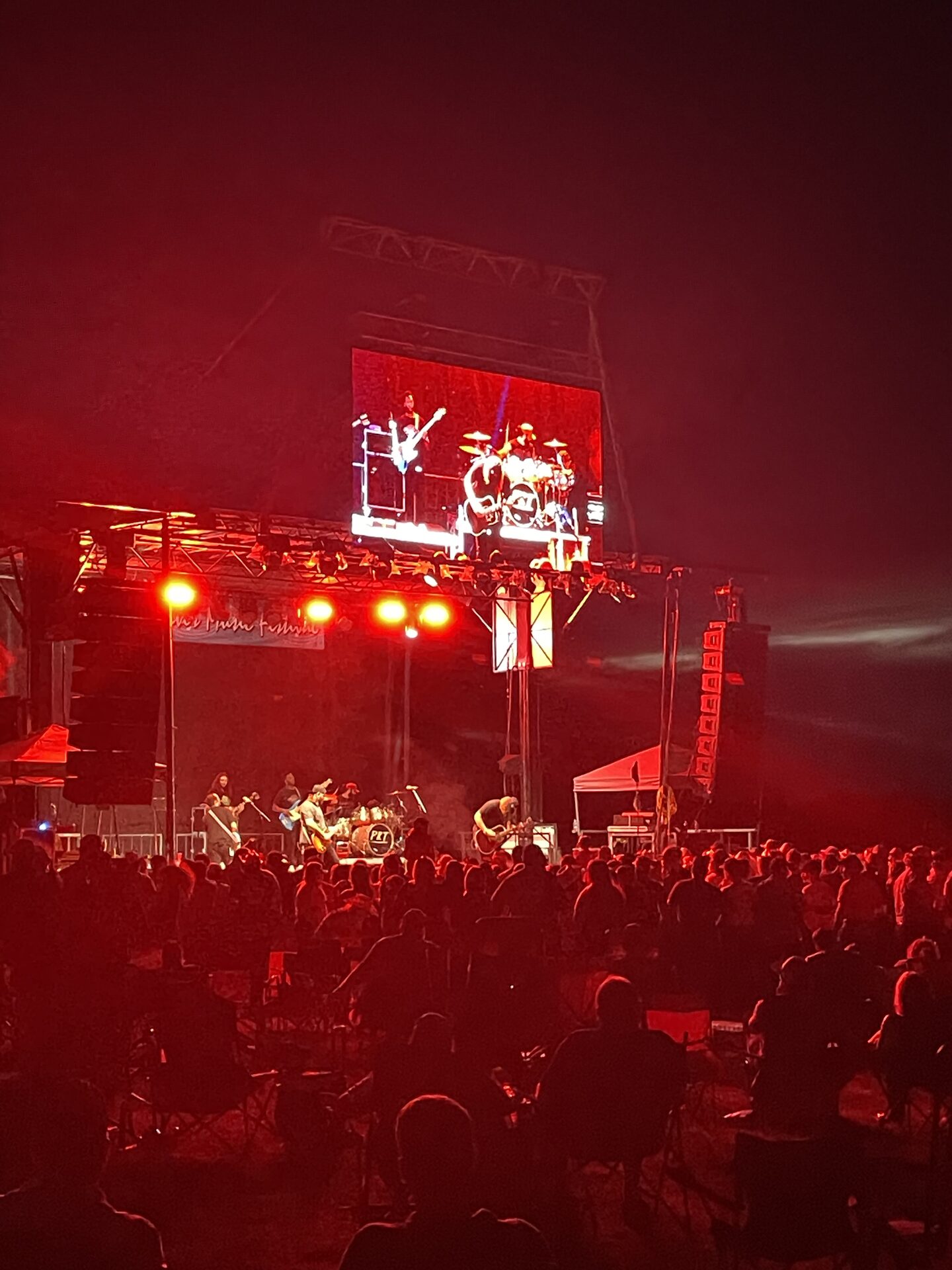 Red stage lights washing over the CRMF crowd