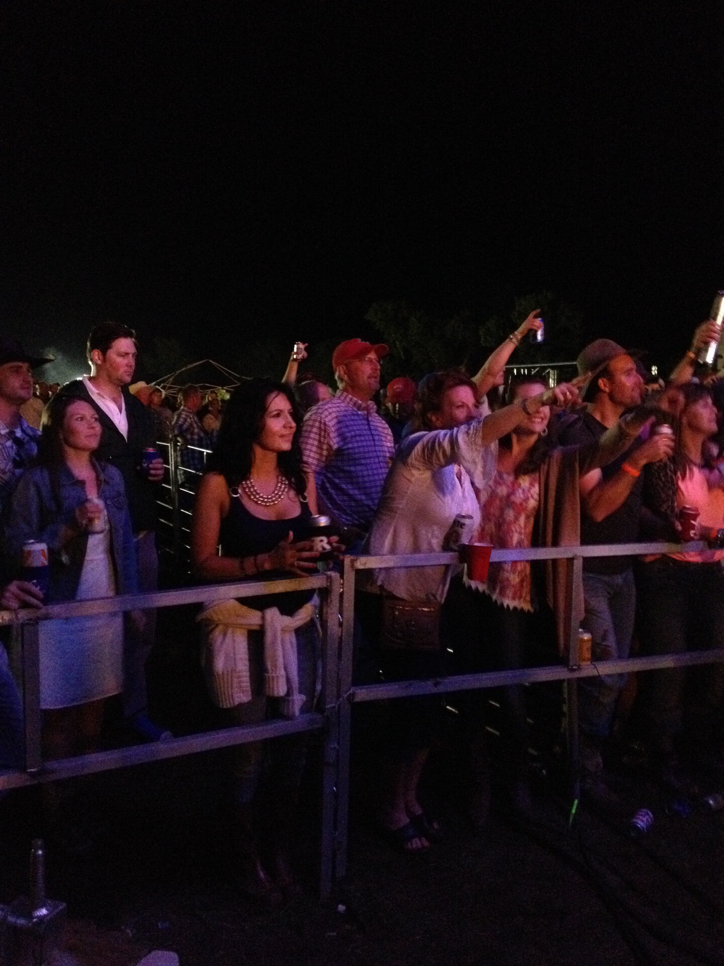 Fans singing along at the front rail of the CRMF stage